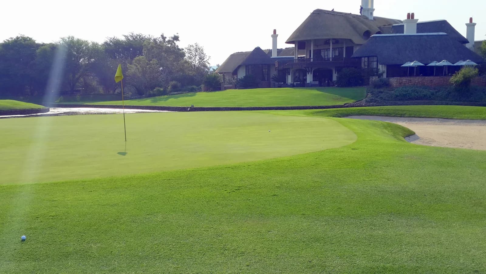 The ninth green and clubhouse at Leopard Creek Country Club