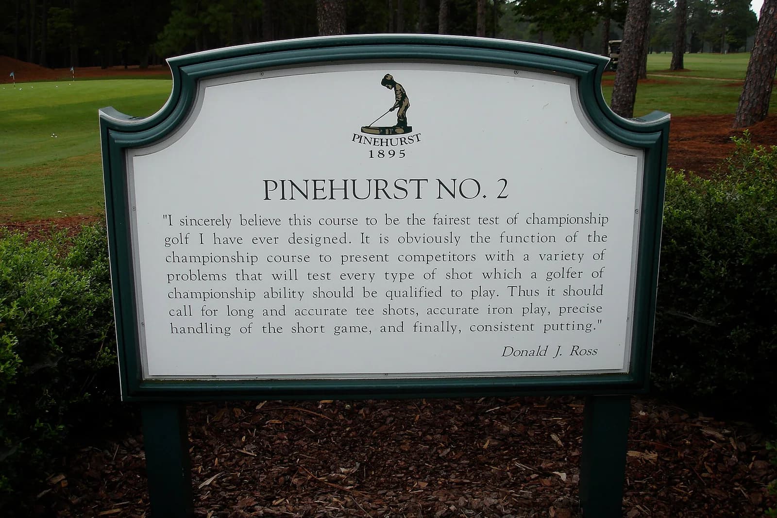 The Pinehurst No. 2 course sign framed by pine trees