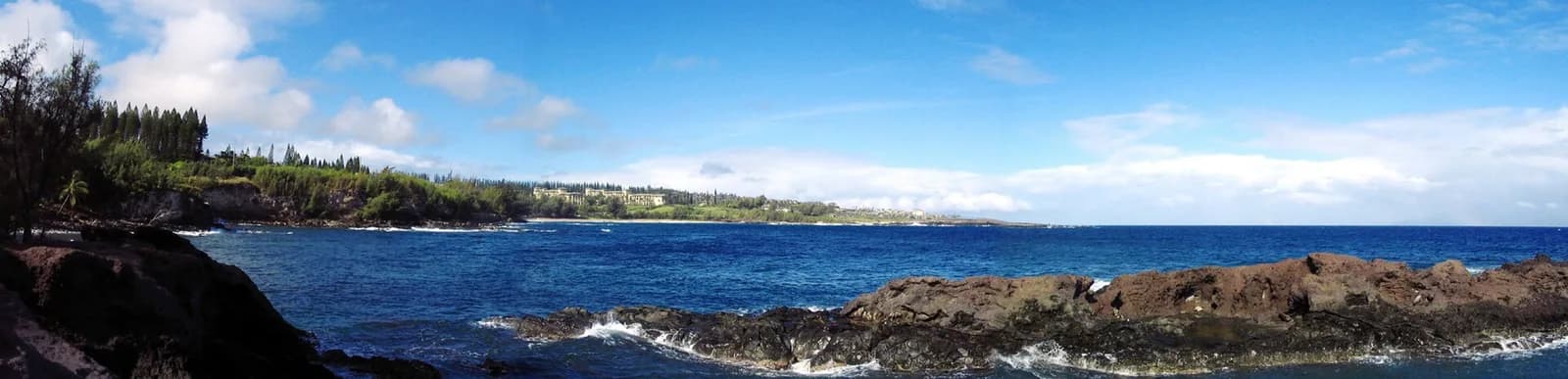 Kapalua on the Maui coast; representative setting, not a photograph of the named golf course