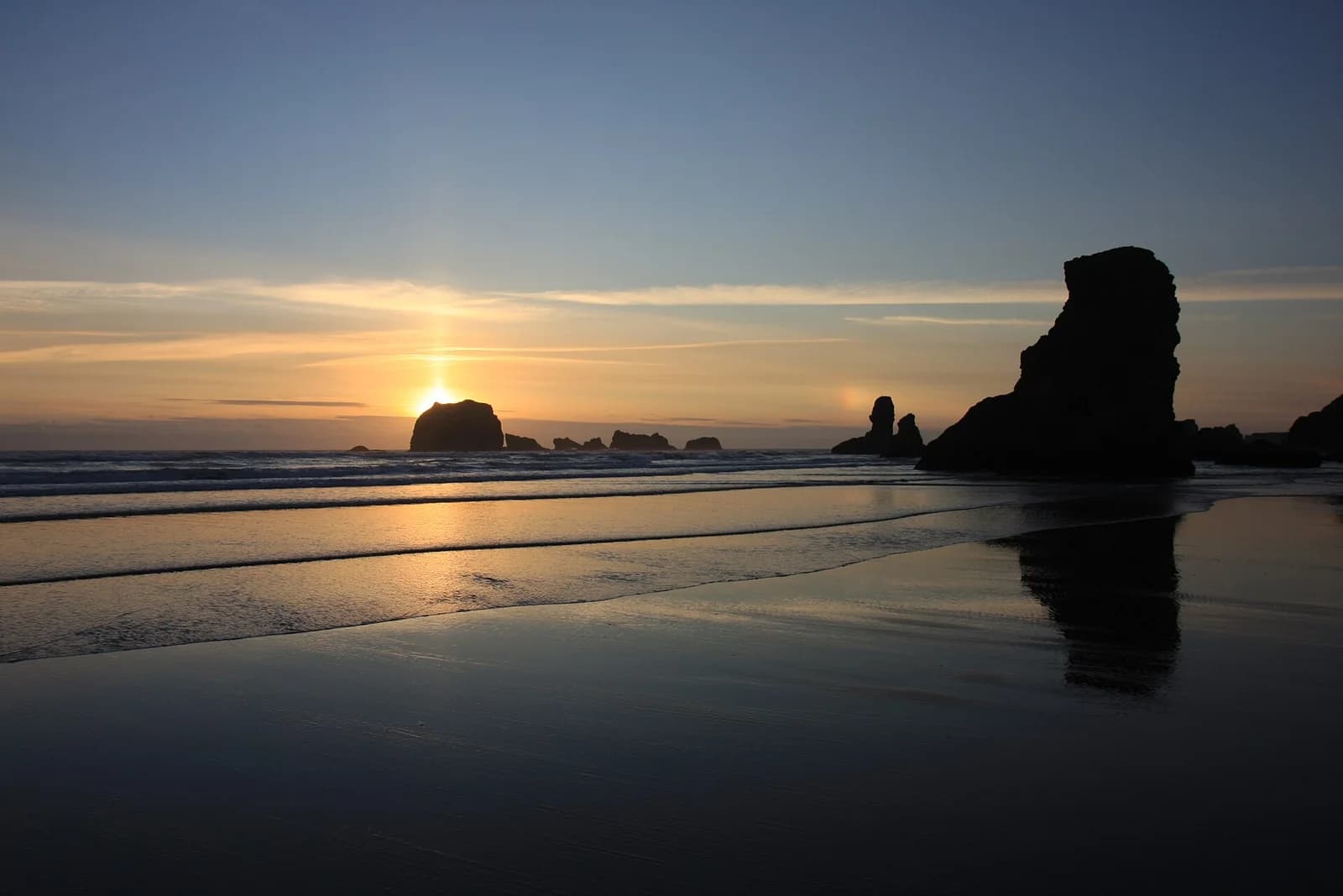 Sunset on the Bandon coast; representative setting, not a photograph of the named golf course