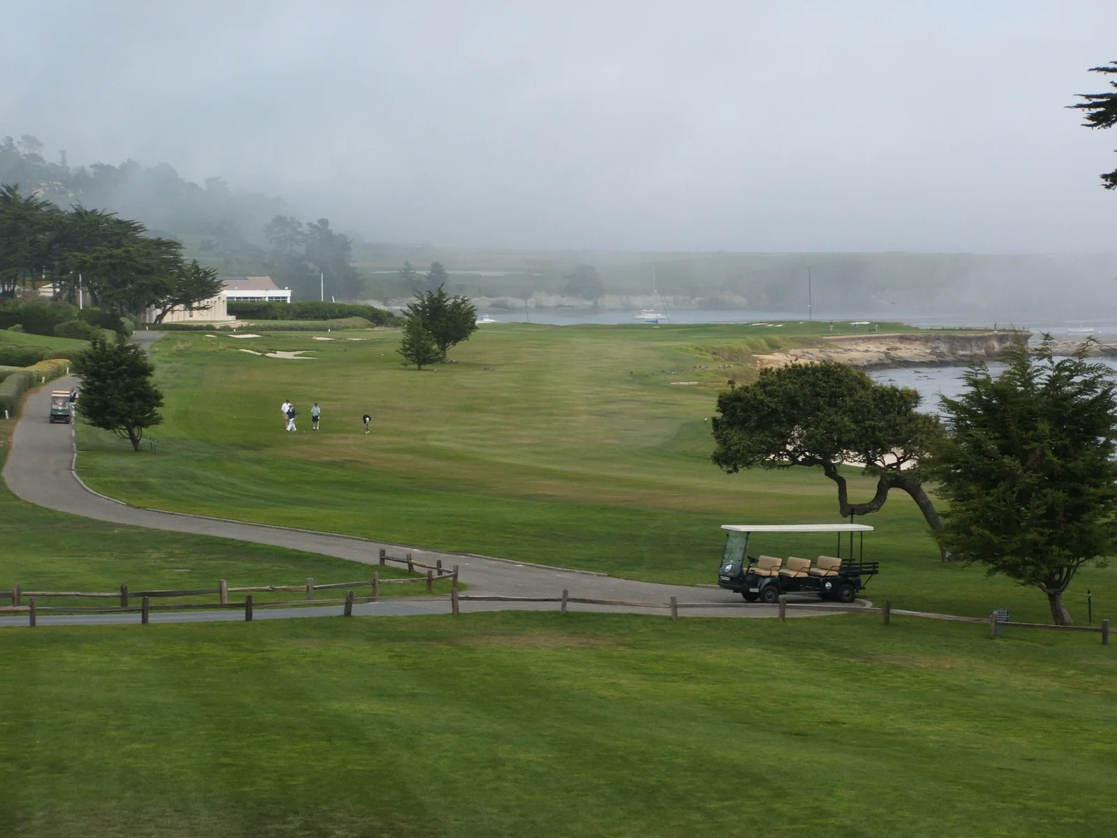 The 18th green at Pebble Beach Golf Links beside Carmel Bay